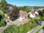 Ansicht Süd-/Ostseite - Entkerntes Zweifamilienhaus mit Terrassengarten, Doppelgarage und toller Aussicht!