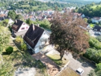 Ansicht Süd-/Westseite - Entkerntes Zweifamilienhaus mit Terrassengarten, Doppelgarage und toller Aussicht!