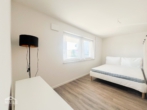 Schlafbereich - Neuwertige 1-Zimmer-Wohnung – Möbliert, barrierefrei und mit Einbauküche